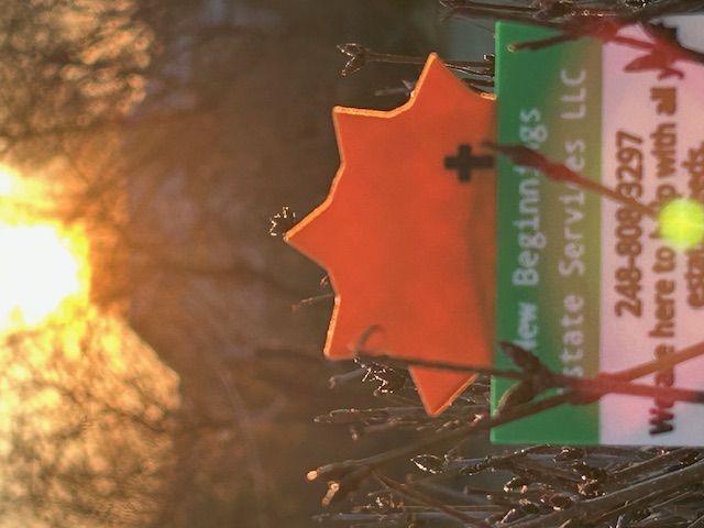 New Beginnings Estate Services sign at sunrise